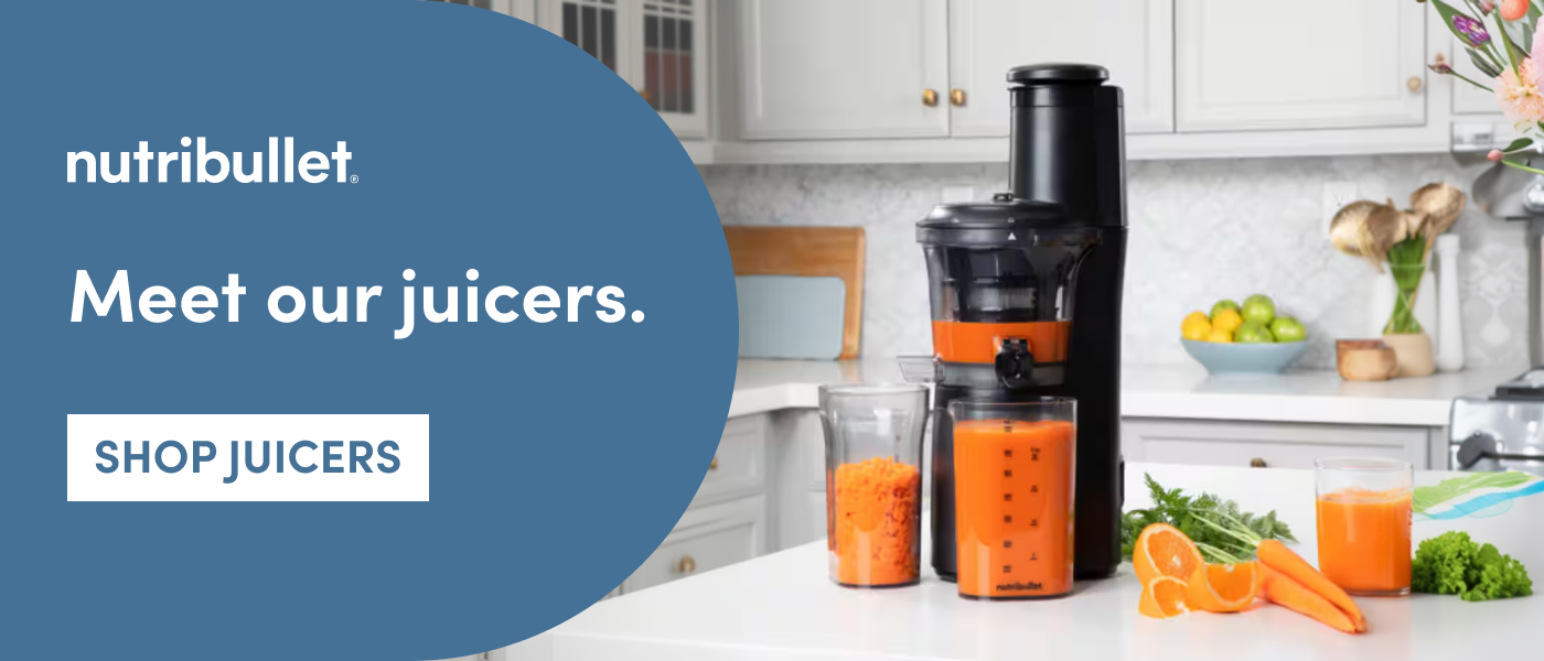 nutribullet juicer on kitchen countertop surrounded by fresh produce
