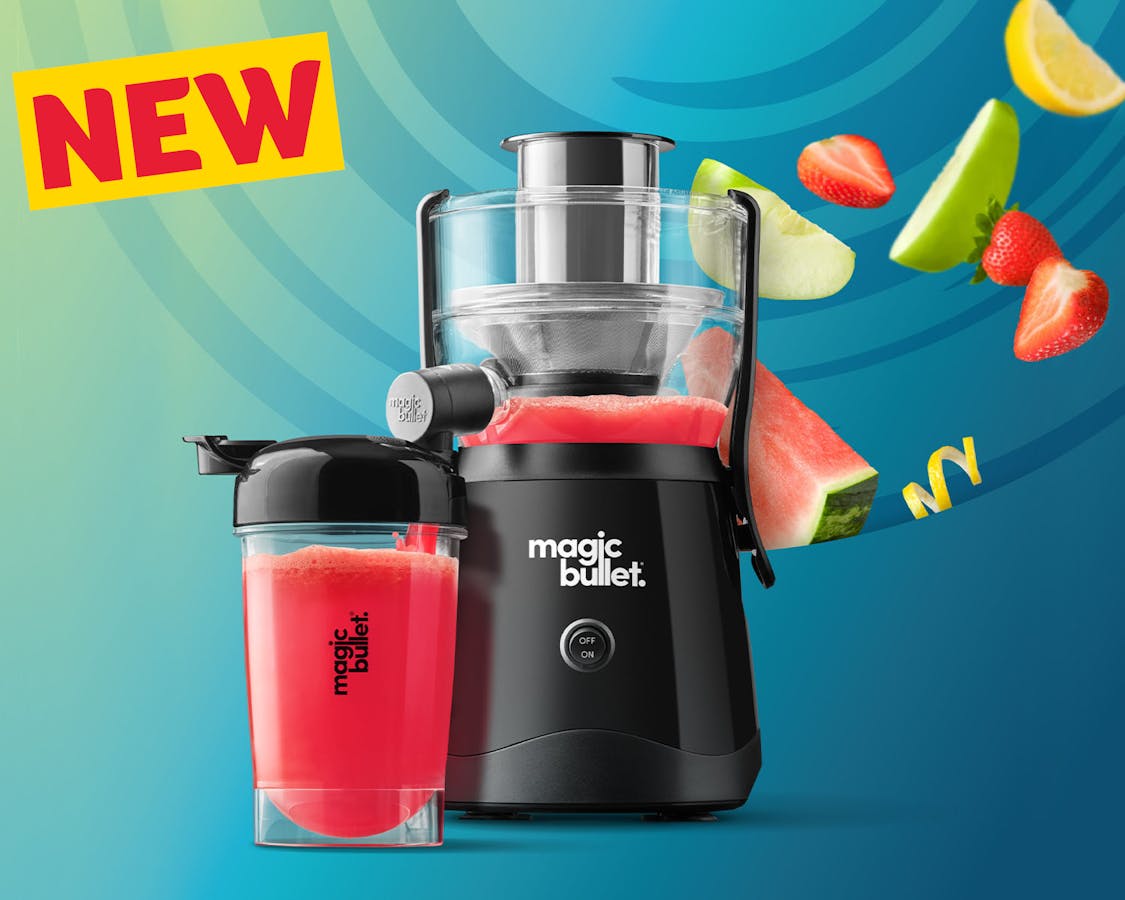 magic bullet mini juicer black and cup with fruit on a blue background with new tag