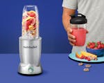 Product preview 5 of 9. Thumbnail of silver nutribullet Pro+ blender with empty pitcher, additional pitcher and accessories for travel.