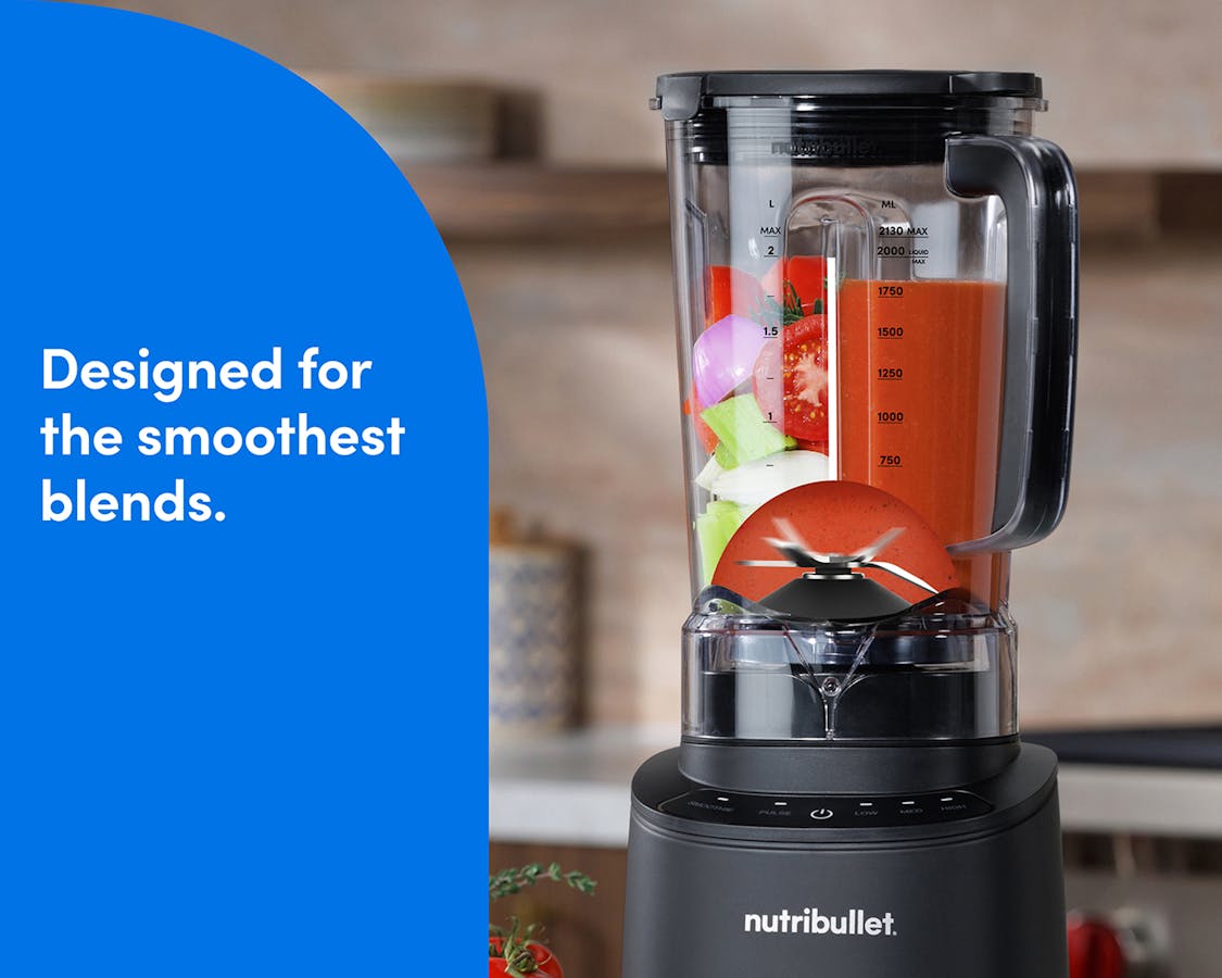 The nutribullet Power Core Blender shown on a kitchen countertop with a woman's hands pressing the Power button.