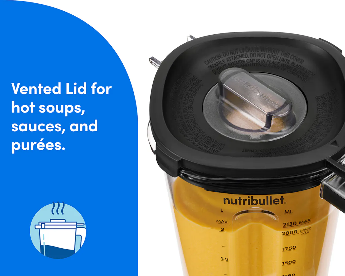 Vented lid with clear lid cap secured on the nutribullet Power Core XL pitcher filled with a warm yellow purée.