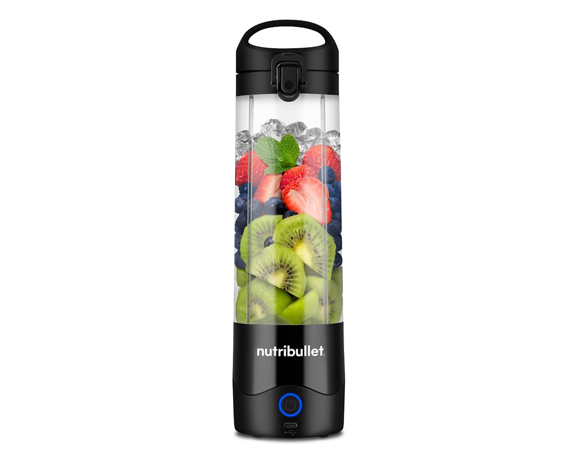 the nutribullet Portable Blender, filled with fruit, stands alone on a white background.