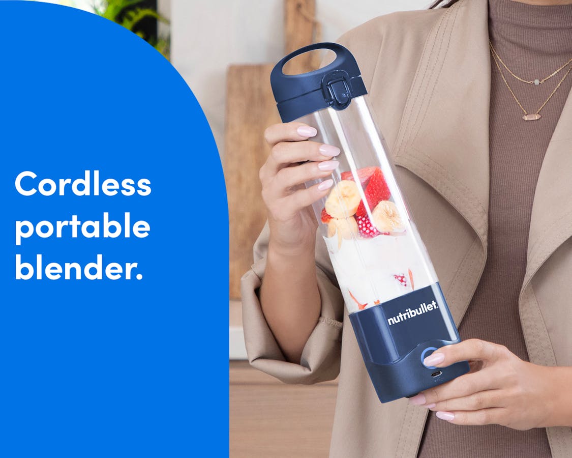A woman dressed in beige holds the nutribullet Portable Blender, filled with fruit and ice. A blue panel on the left reads: "cordless portable blender."