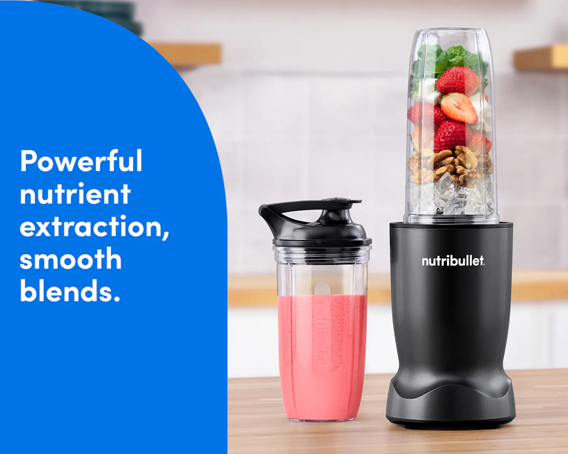 Matte Black nutribullet Turbo blender blending fresh fruit into a smoothie alongside a to-go cup