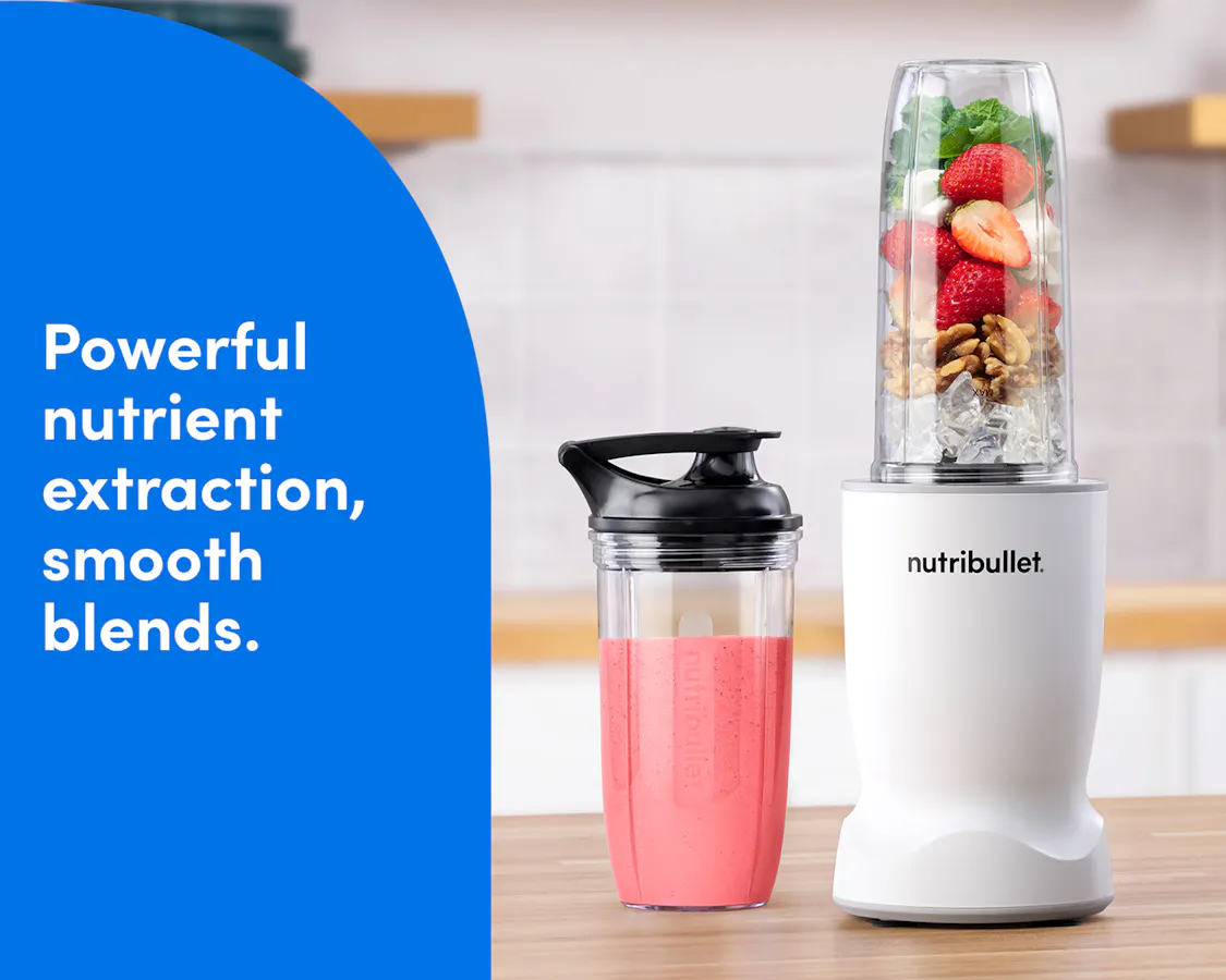 Matte White nutribullet Turbo blender blending fresh fruit into a smoothie alongside a to-go cup