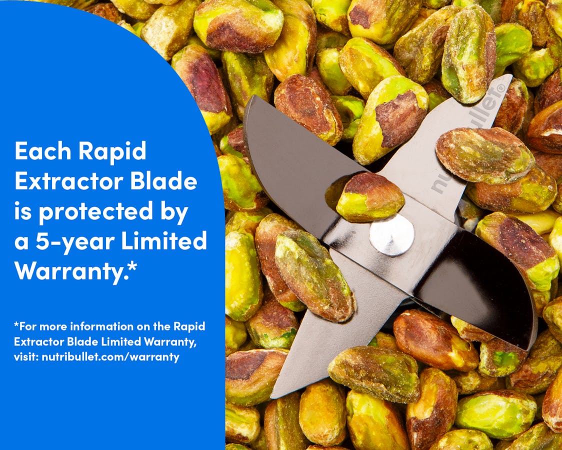 Closeup image of the titanium-coated blade points emerging from a pile of shelled pistachios. Text reads: Each Rapid Extractor Blade is protected by a 5-year Limited Warranty*. Fine print reads: For more information on the Rapid Extractor Blade Limited Warranty, visit nutribullet.com/warranty.