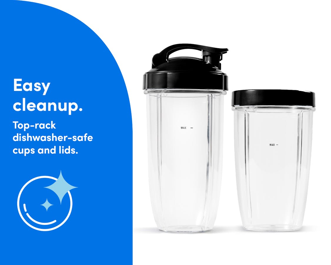 Two empty blending cups are placed side-by-side. One has the Flip-Top To-Go Lid attached, the other, the Comfort Lip Ring