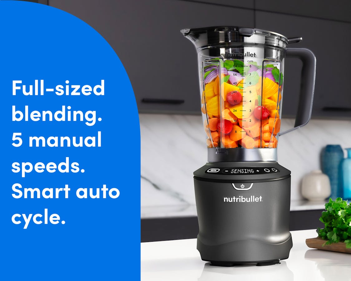 The SmartSense Blender is shown filled with colorful fruits and vegetables on a marble countertop. A blue panel to the left of the image reads "full-sized blending. 5 manual speeds. Smart auto cycle."