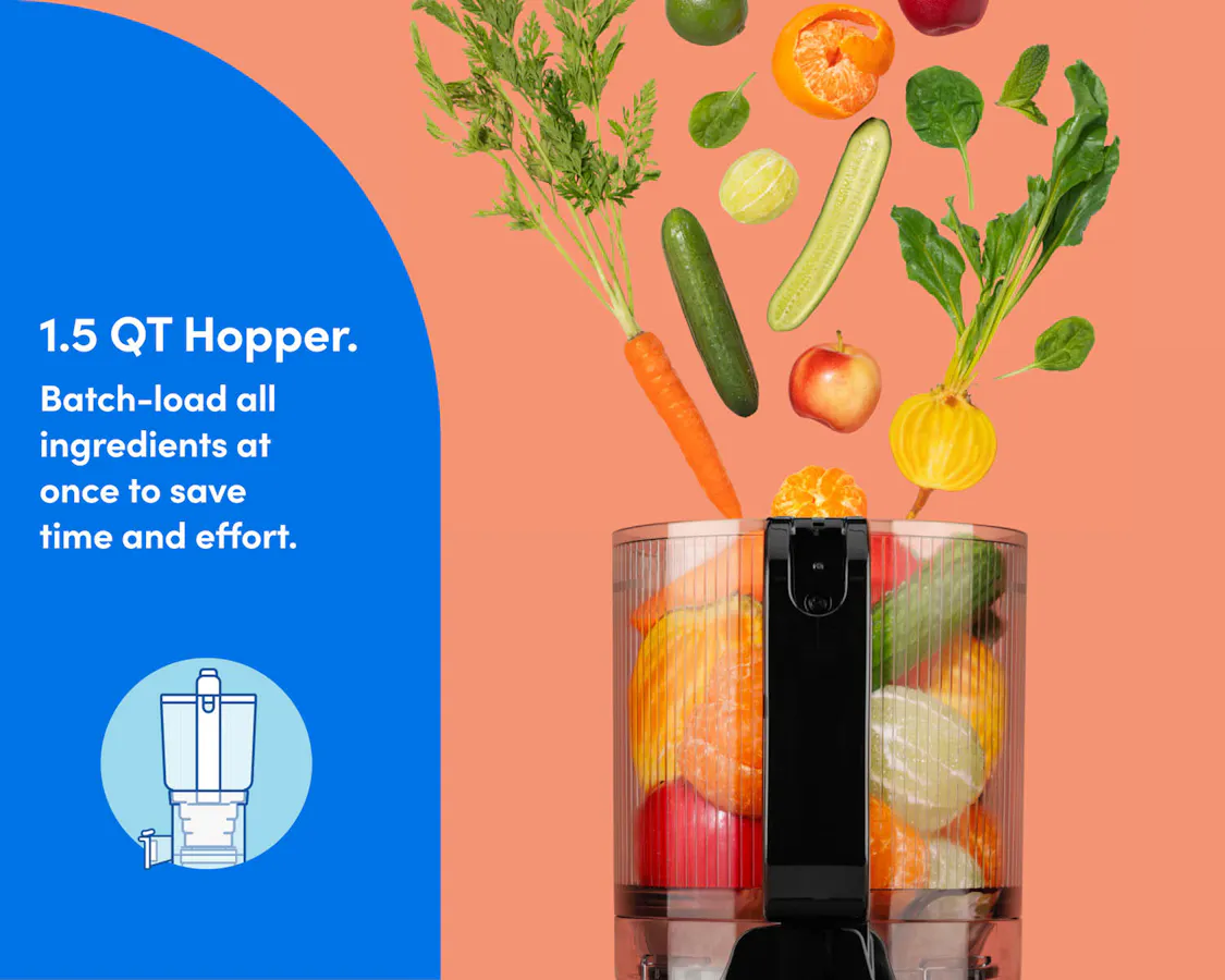 A closeup of the hopper with whole vegetables and fruits flying in.