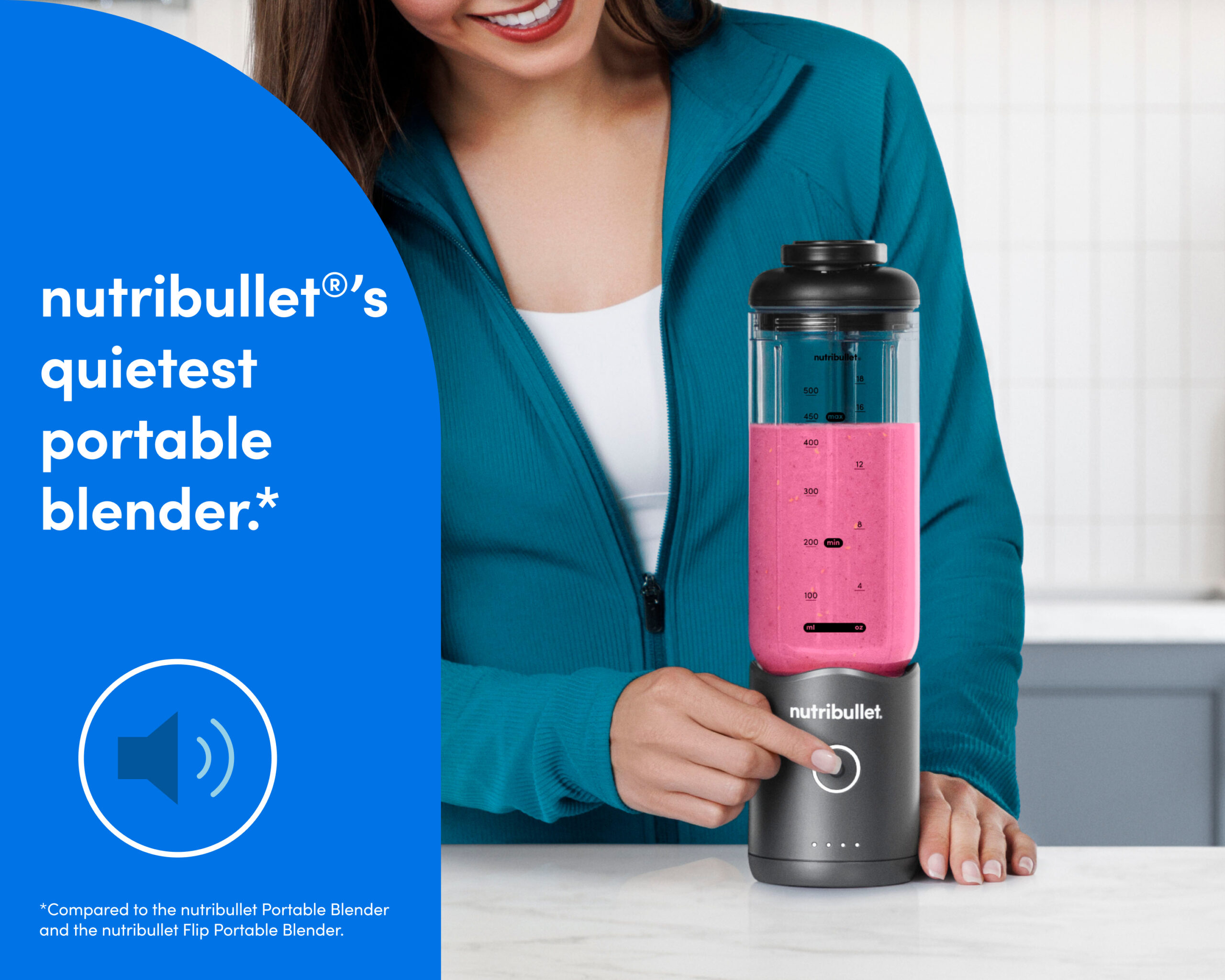 Woman blending a pink smoothie in a nutribullet Flex portable blender on a kitchen counter