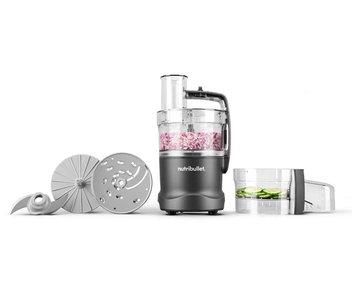 The nutribullet Limitless Food Processor displayed with its slicing disc, chopping blade, and feed chute components.