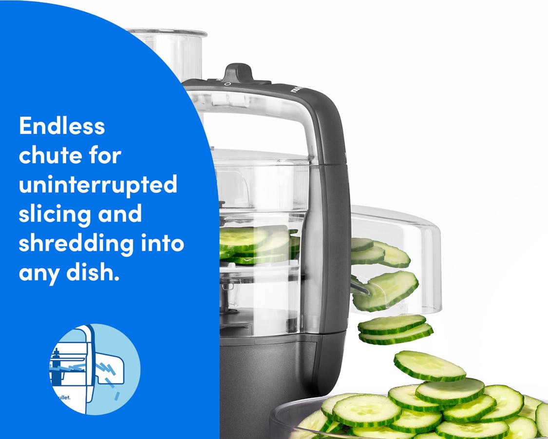 The nutribullet Limitless Food Processor shown slicing cucumbers through its endless chute attachment.