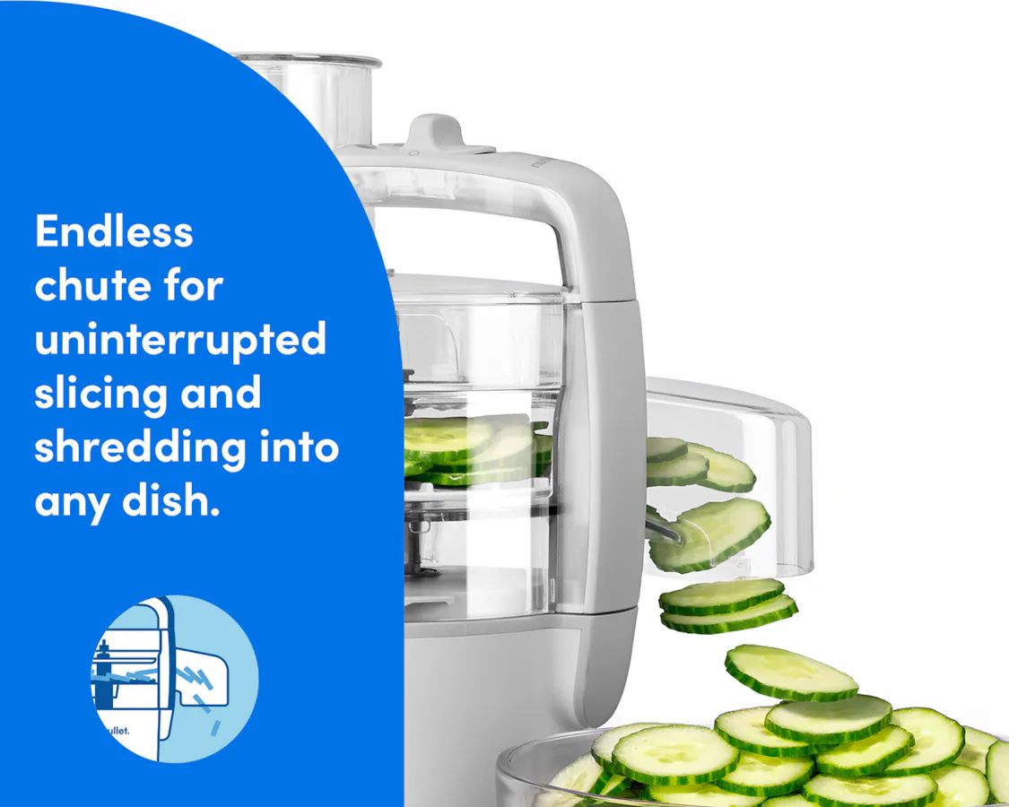 The nutribullet Limitless Food Processor shown slicing cucumbers through its endless chute attachment.