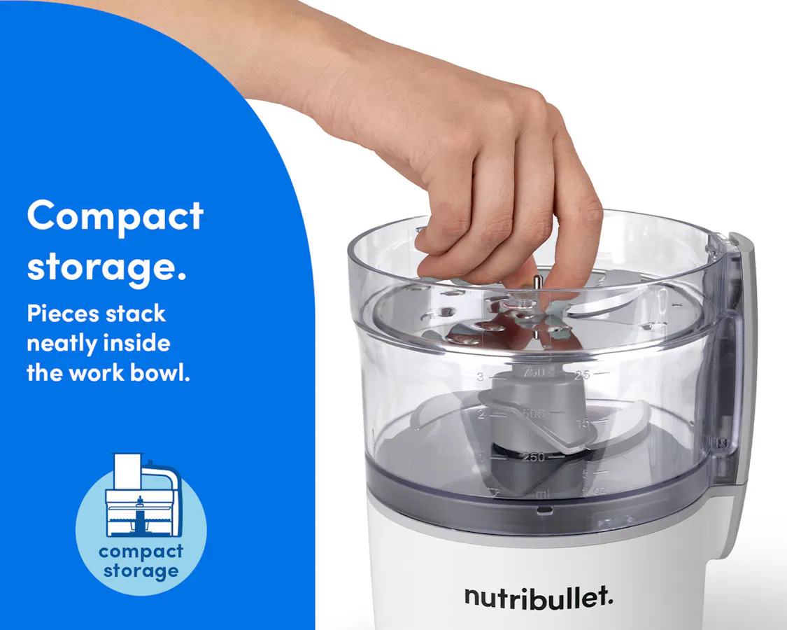 Hand placing parts inside the bowl of the nutribullet Limitless Food Processor for easy, compact storage.