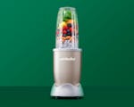 Product preview 1 of 7. Thumbnail nutribullet Champagne with fruit, vegetables, and nuts on green background.
