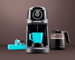 Product preview 1 of 7. Thumbnail of NEW machine making coffee in blue mug with full carafe, pods beside it.