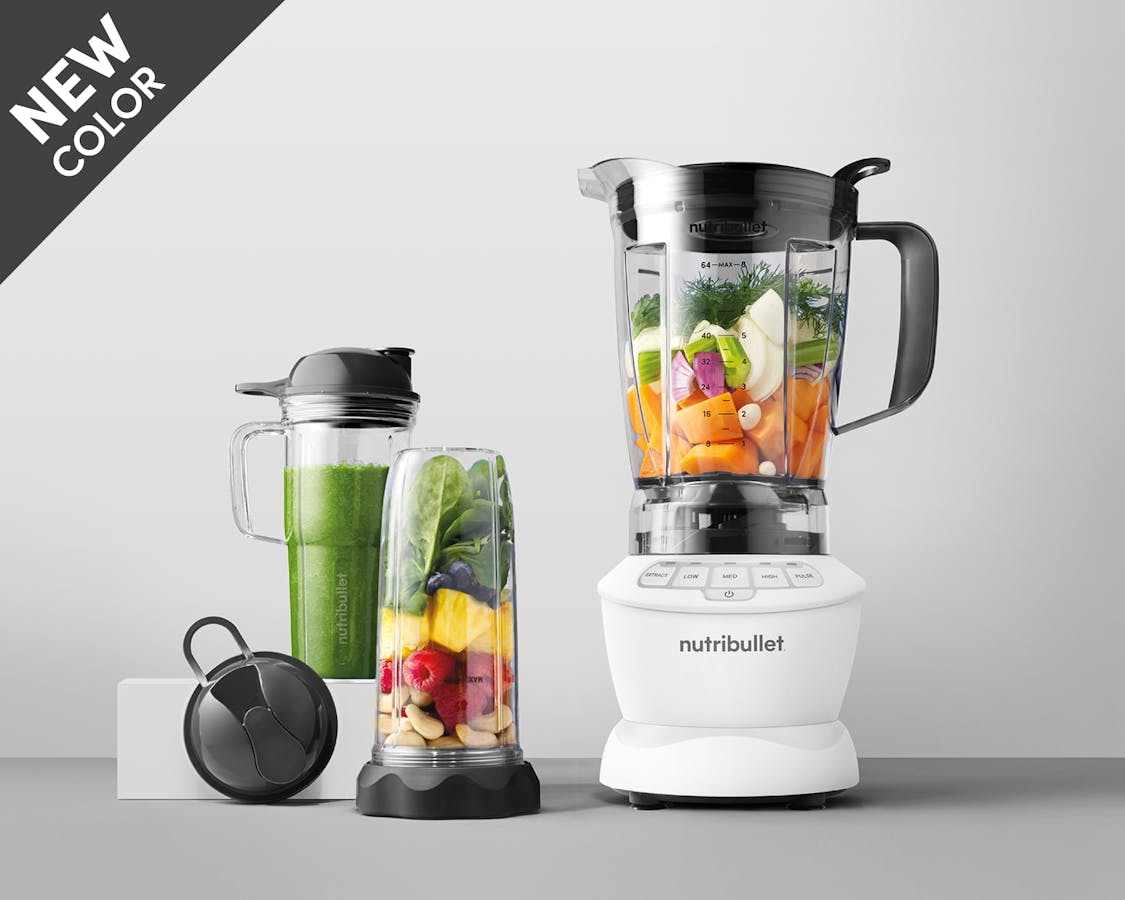 Matte white nutribullet blender combo filled with fruit and vegetables with new tag.