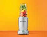 Product preview 1 of 9. Thumbnail of silver nutribullet Pro+ blender filled with berries, pineapple and banana on white countertop.