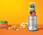 Product preview 5 of 9. Thumbnail of silver nutribullet Pro+ blender with empty pitcher, additional pitcher and accessories for travel.