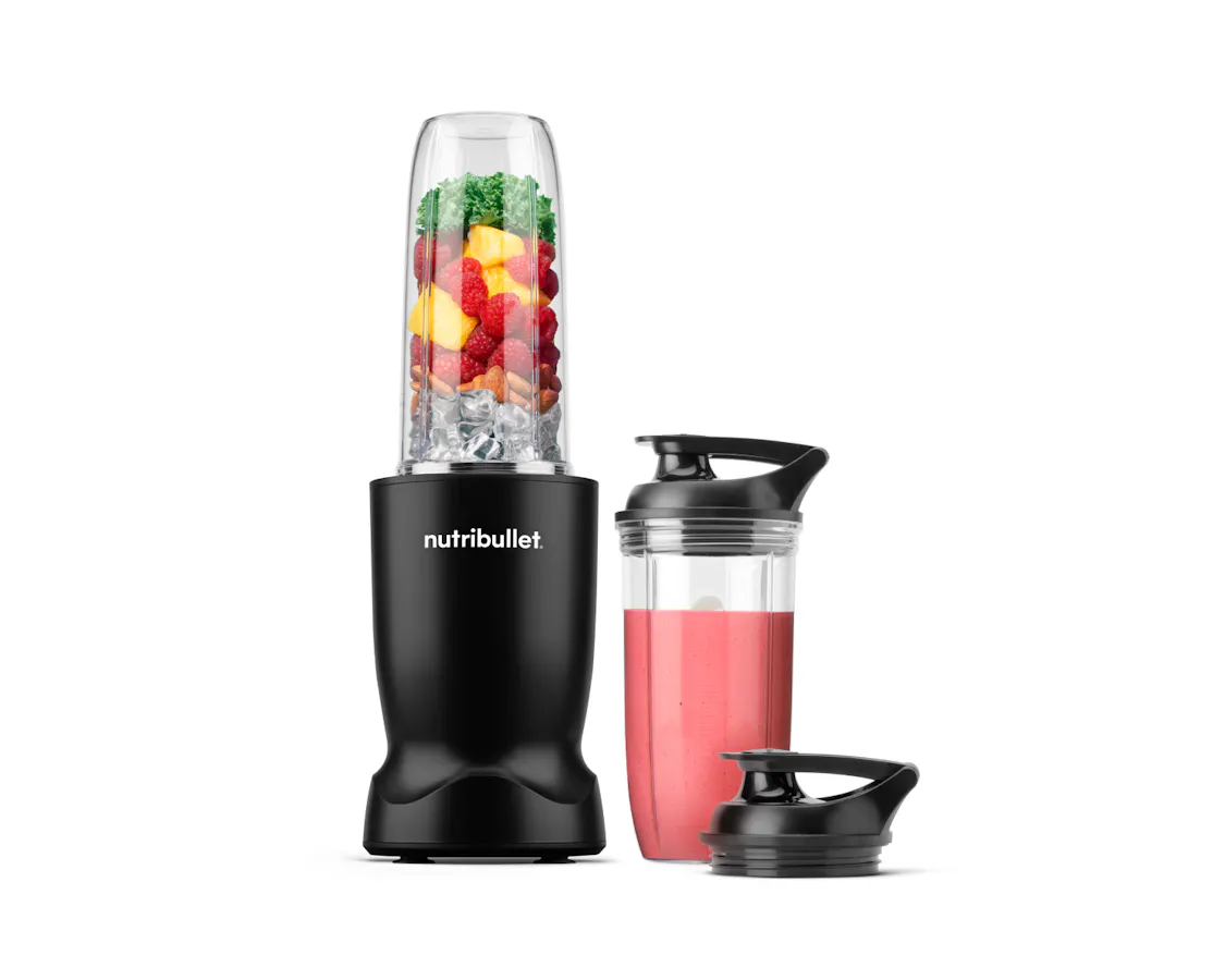 nutribullet Turbo blender in matte black with a filled blending cup, smoothie cup, and travel lid