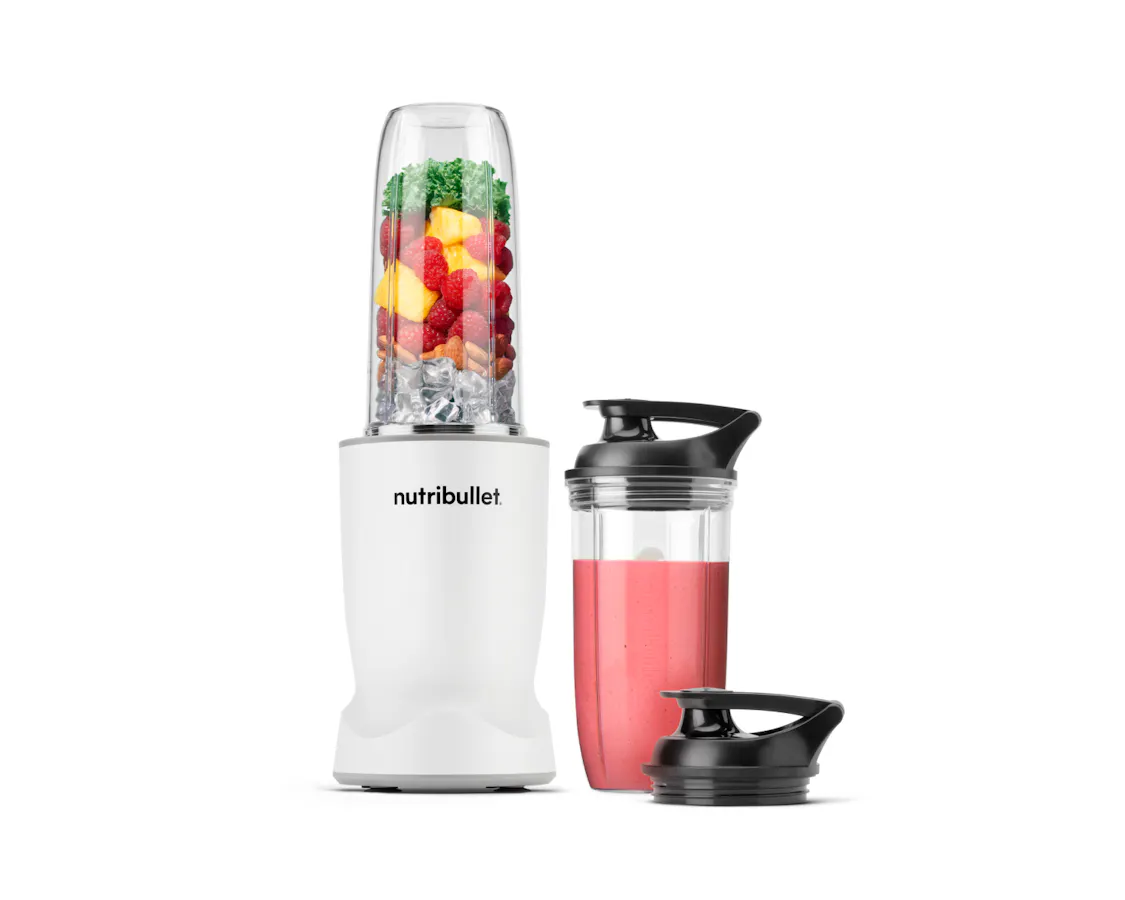 nutribullet Turbo blender in white with a filled blending cup, smoothie cup, and travel lid