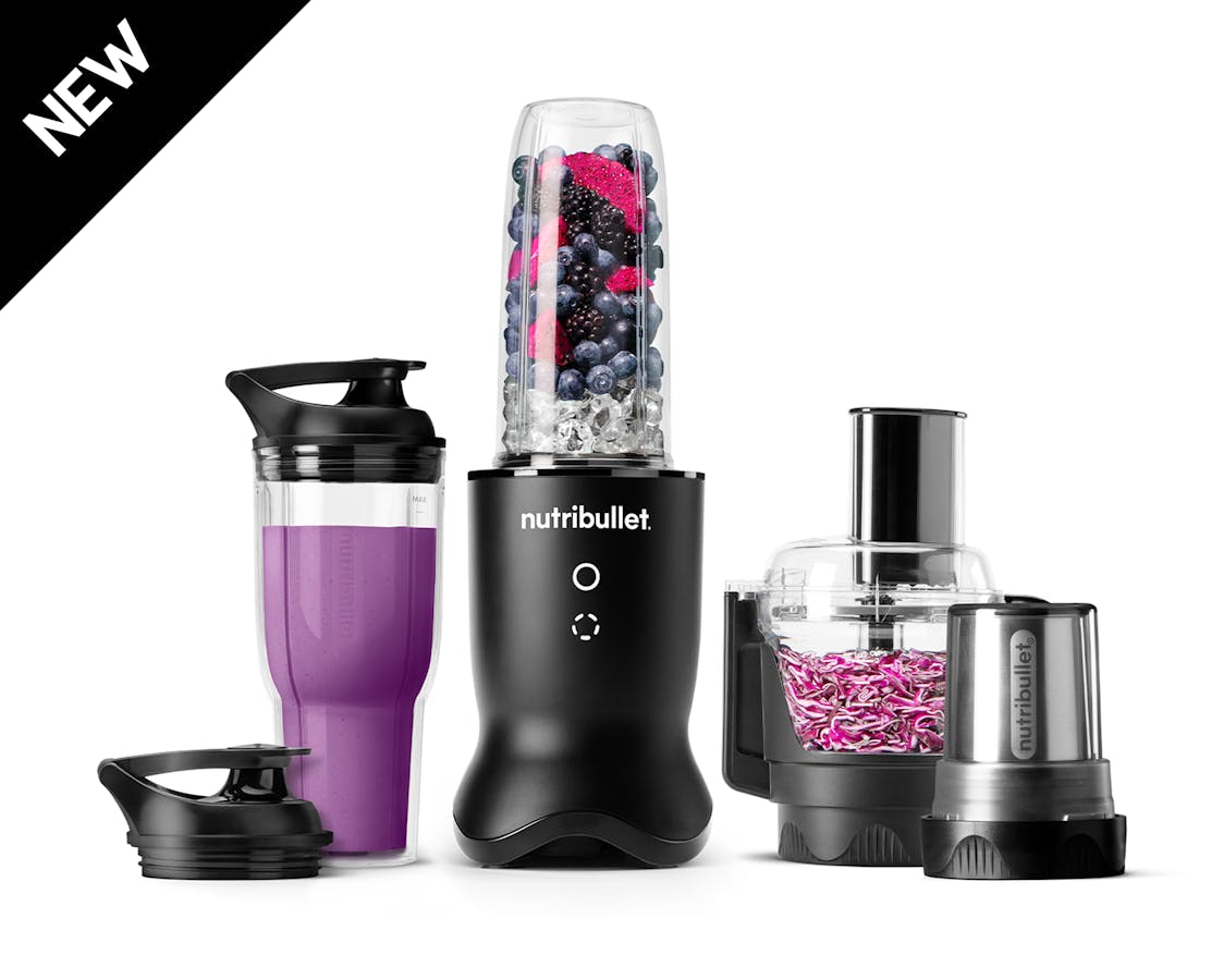 The nutribullet Ultra Plus in satin black set with a sleek metallic base, a blending cup filled with fruits and ice, a travel cup with a lid, a food processor bowl, and a milling cup, all arranged on a white background.
