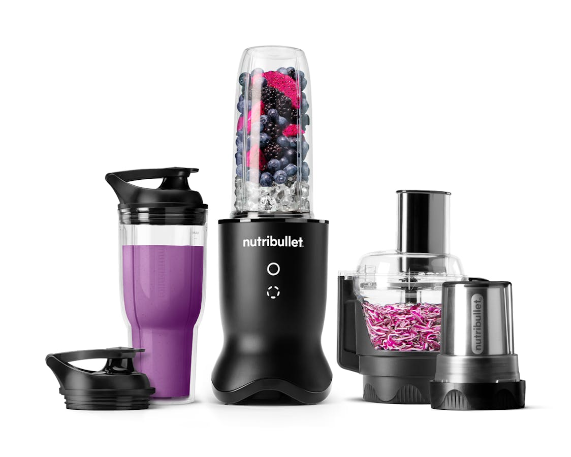 The nutribullet Ultra Plus in satin black set with a sleek metallic base, a blending cup filled with fruits and ice, a travel cup with a lid, a food processor bowl, and a milling cup, all arranged on a white background.