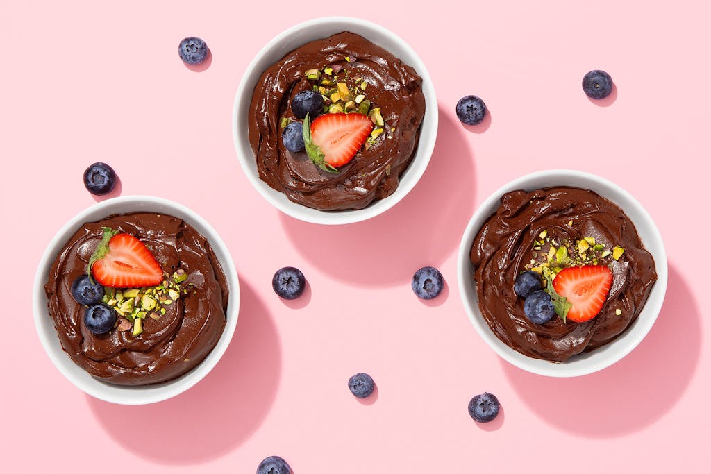 coffee mocha pudding with fresh berries and nuts