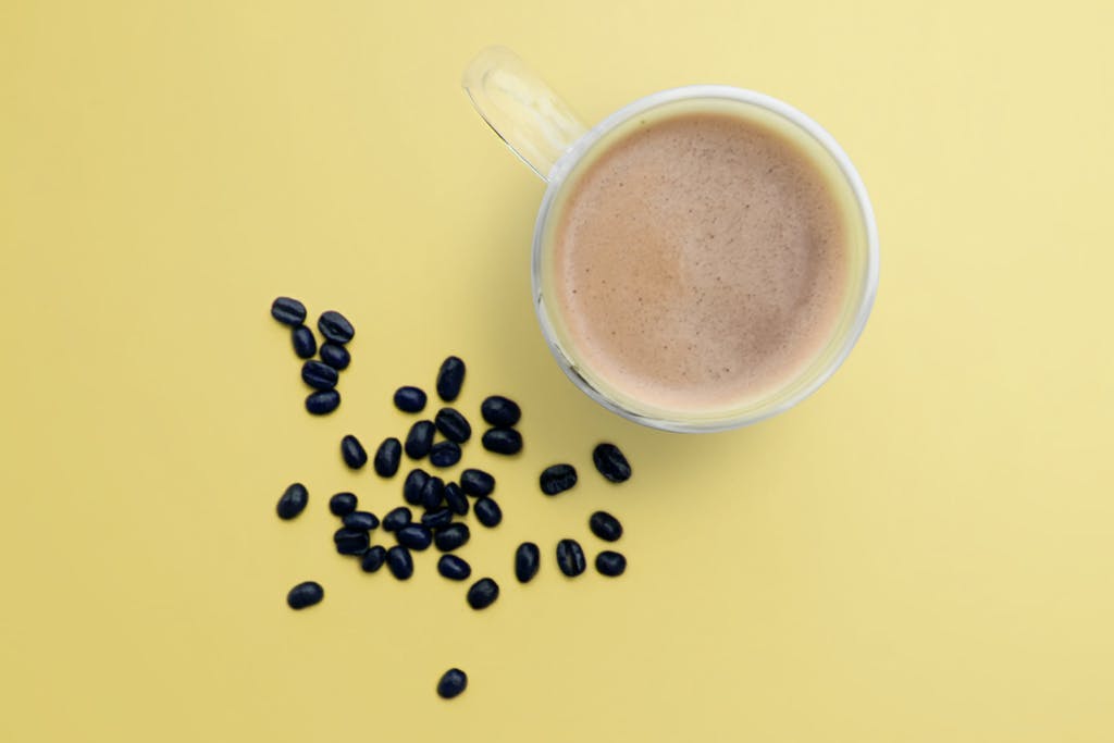 top down view of coffee smoothie with coffee beans
