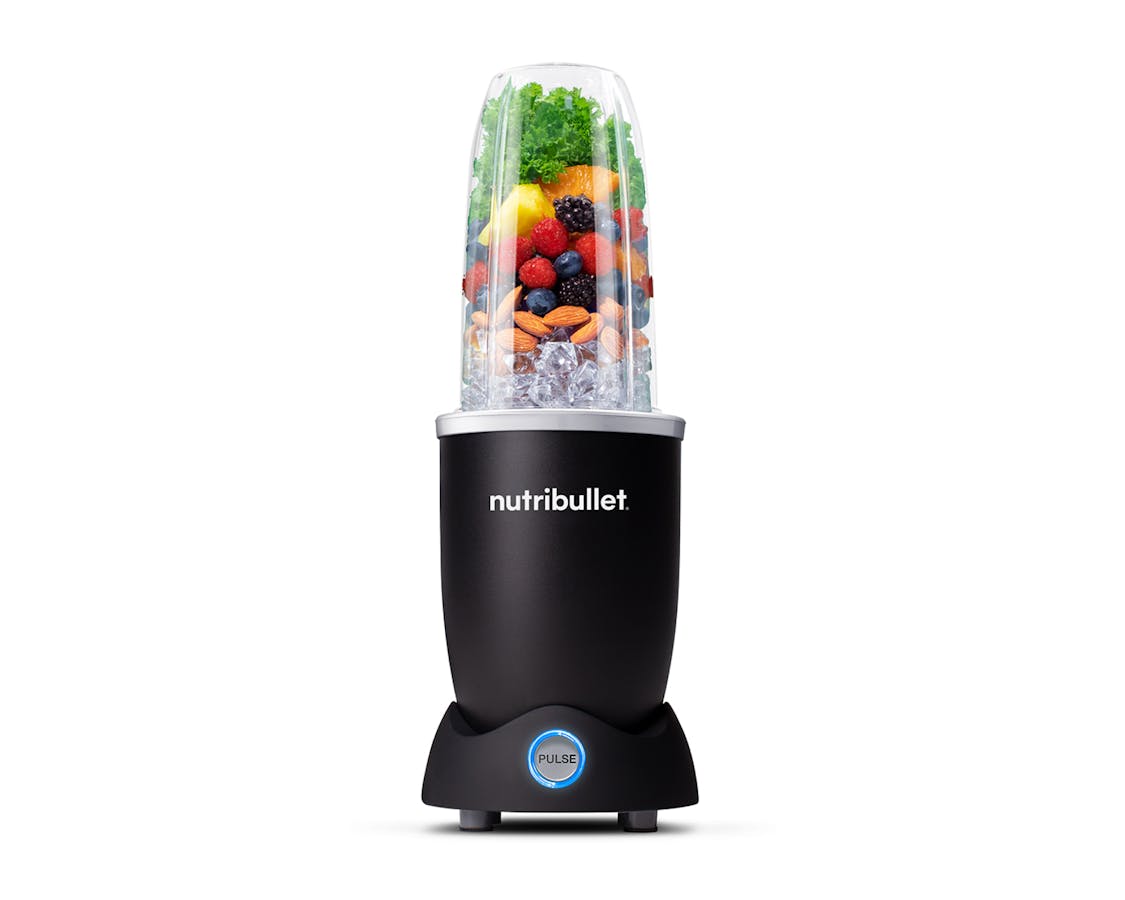 matte black nutribullet pro plus filled with fruit on a white background