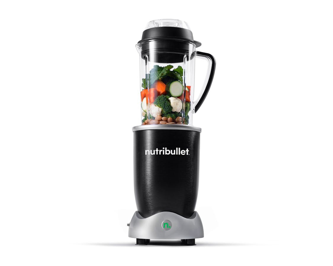 nutribullet Rx with vegetables and beans on white background.