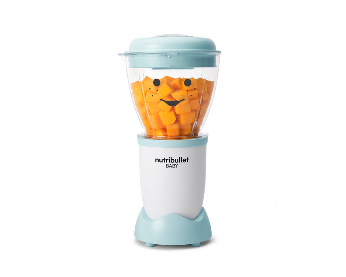 nutribullet Baby with carrots on white background.