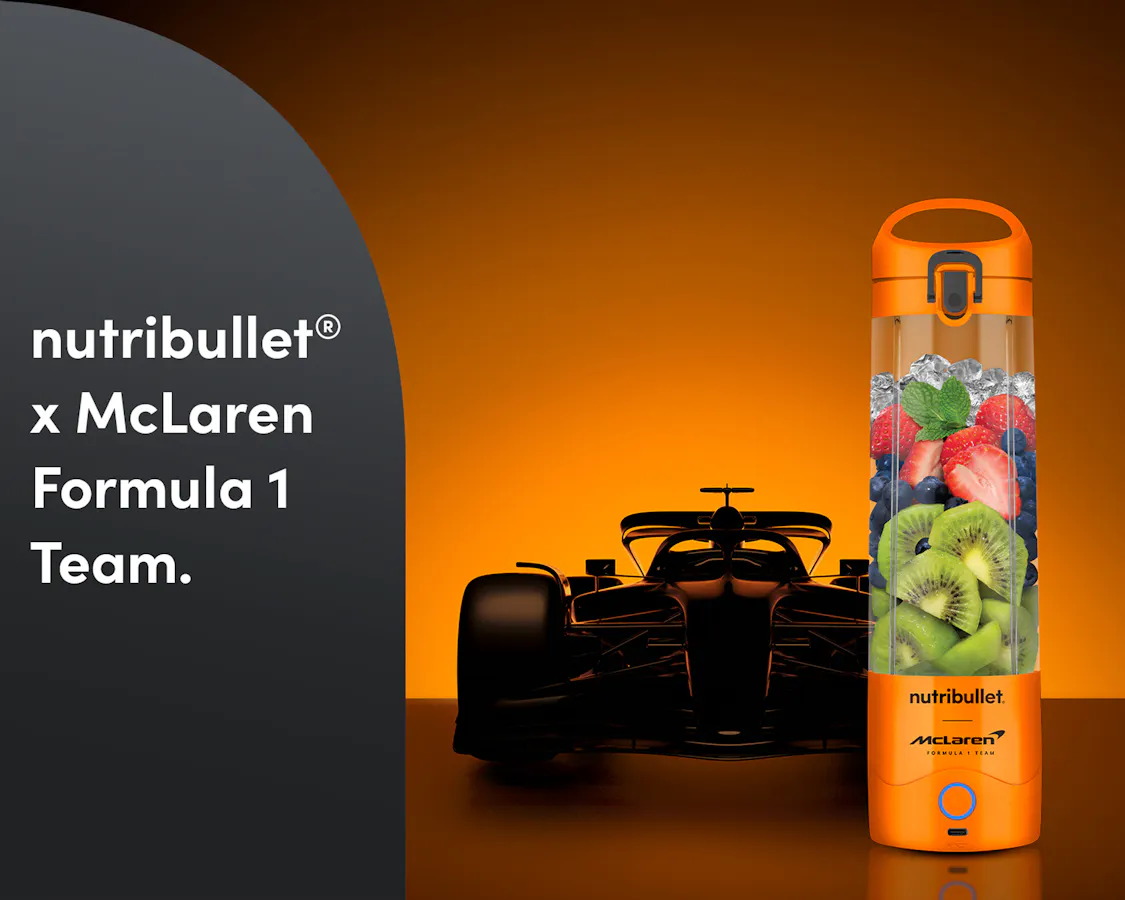 The nutribullet® x McLaren: Portable with fresh fruit and a Formula 1 car in the back. A gray panel reads "nutribullet® x McLaren Formula 1 Team".