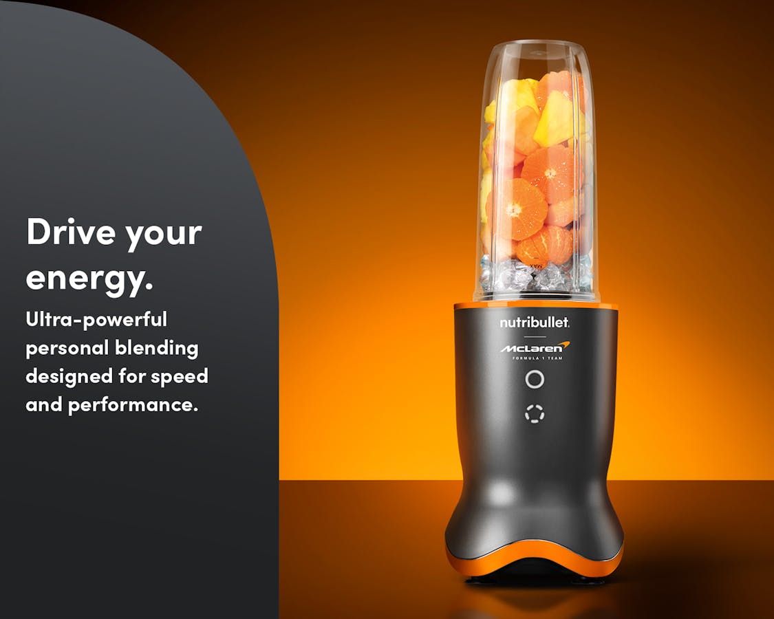The nutribullet® x McLaren: Ultra with fresh fruit and ice on an orange and black background. A gray panel on the left reads "Drive your energy".