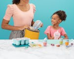 Product preview 1 of 9. Thumbnail woman with young girl with assorted nutribullet Baby products with a blue background.