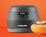 Product preview 2 of 9. Thumbnail of gray EveryGrain Cooker with yellow bowl of rice and salmon on orange background.