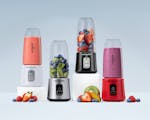 Product preview 2 of 3. Thumbnail of white, silver, black and red nutribullet Gos filled with smoothies and sliced fruit on gray background.