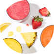Cups of juice with strawberries, pineapple slice and a lemon slice