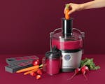 Product preview 2 of 7. Thumbnail juicer with fruits and vegetables on purple background.
