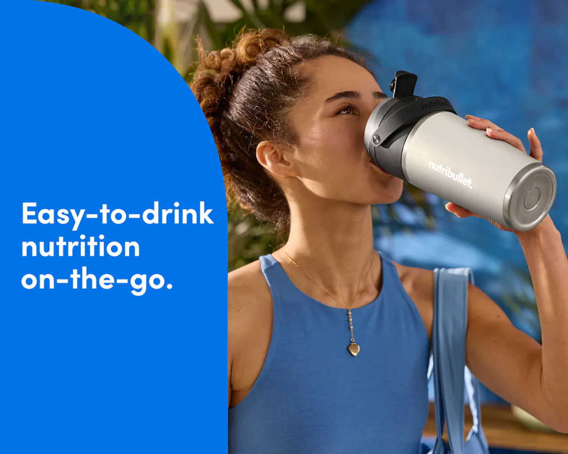 Woman drinking from the nutribullet Flip Insulated Portable Blender. Easy-to-drink nutrition on-the-go.
