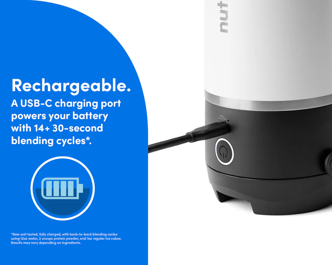 Zoomed-in image of the white nutribullet Flip tumbler with the charger inserted into the charging port just above the illuminated blending button. Rechargable. A USB-C charging port powers your battery with 14+ 30-second blending cycles.