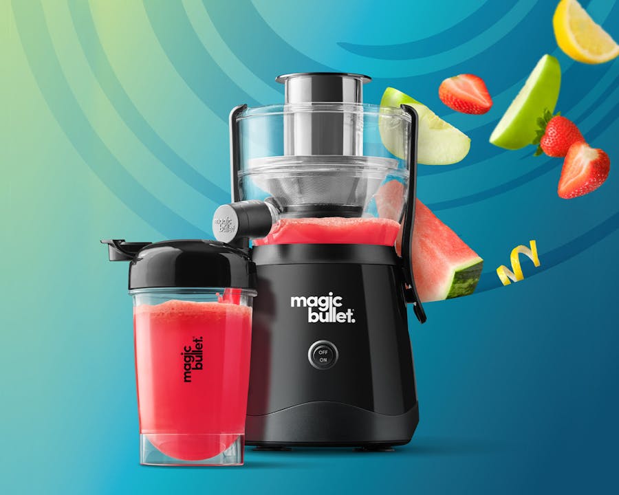 magic bullet mini juicer black and cup with fruit on a blue background